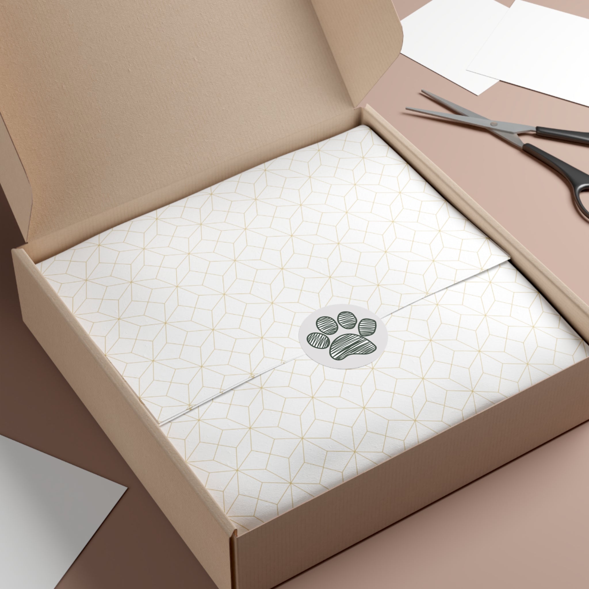 Open box with a white textured interior and a green circular logo, scissors on the side.