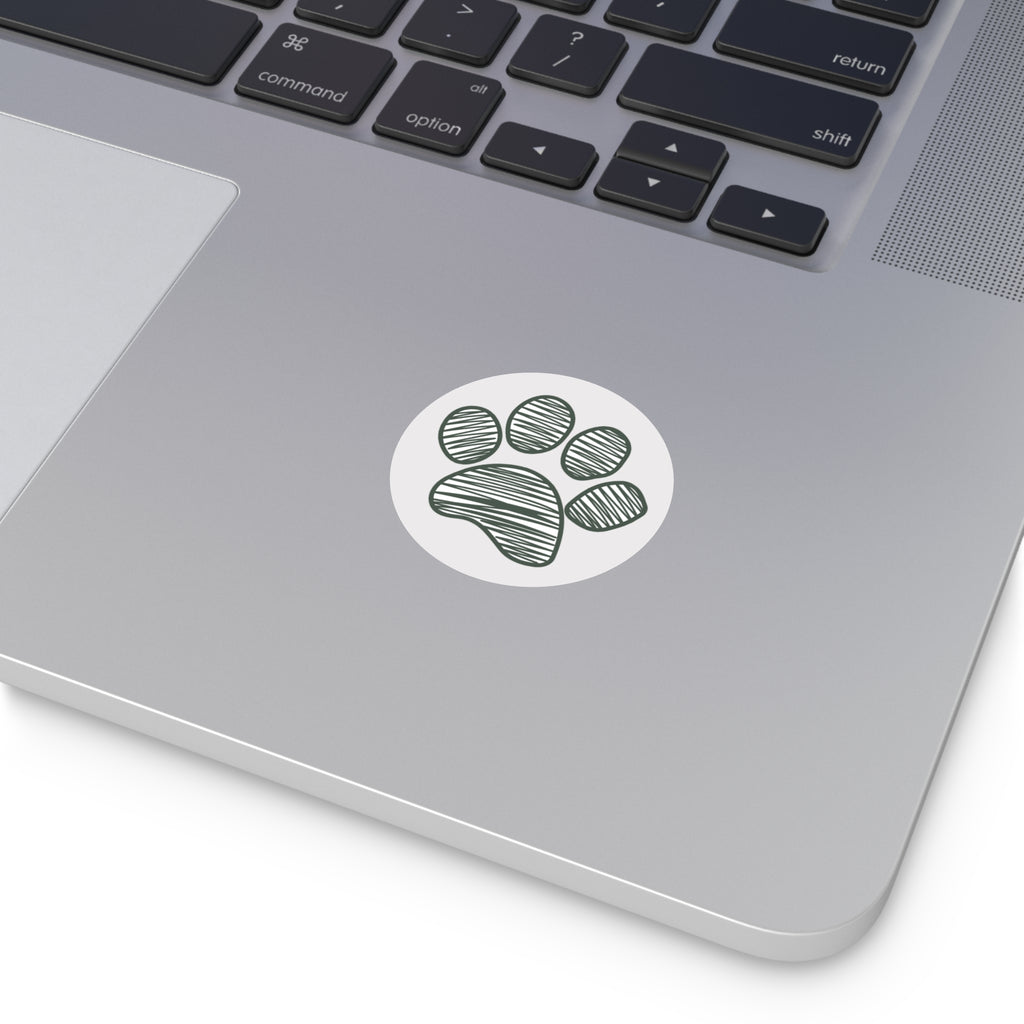 Laptop with a paw print sticker on the palm rest area
